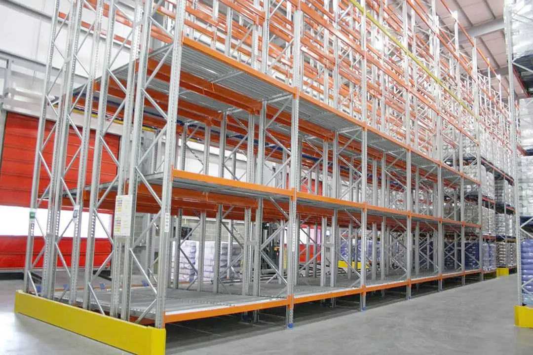Warehouse with empty push-back storage racks.
