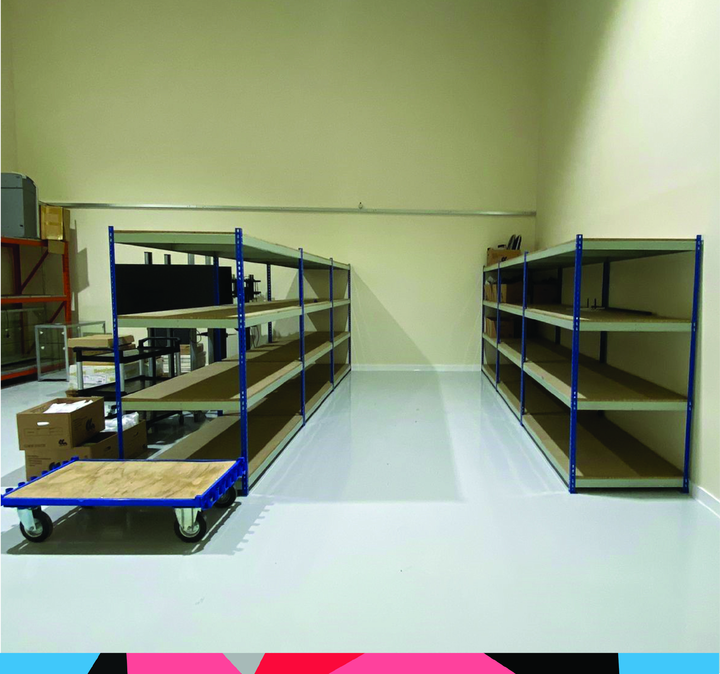 unilever 3 Shows blue and grey painted steel boltless shelving in 2 rows, installed in a warehouse space. The bays are deeper bays
